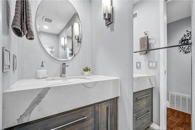 631 Holmes Ave, Placentia, CA 92870 - bathroom with vanity, wood finished floors, and baseboards