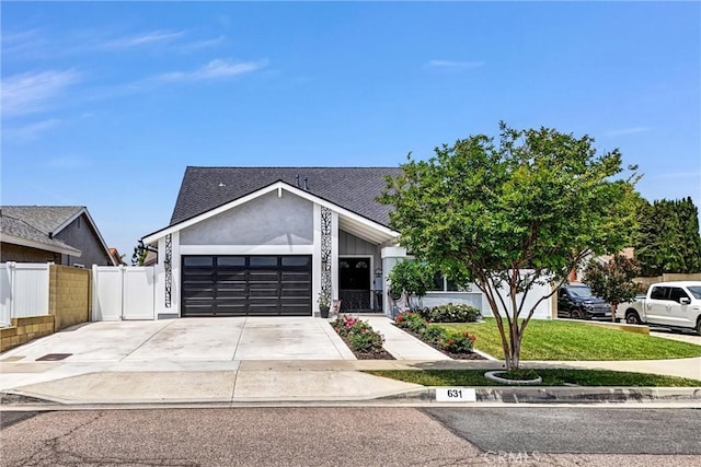 631 Holmes Ave, Placentia, CA 92870 - view of front facade with a garage, concrete driveway, and a shingled roof