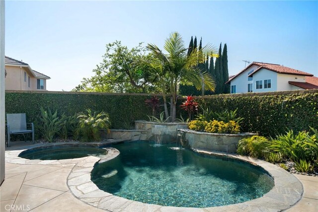 4583 Tuscani Dr, Cypress, CA 90630 - view of pool featuring a fenced backyard, a pool with connected hot tub, and a patio area