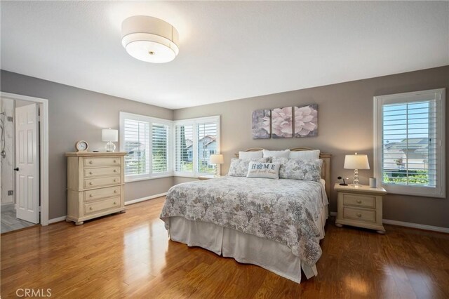 4583 Tuscani Dr, Cypress, CA 90630 - bedroom featuring baseboards and wood finished floors