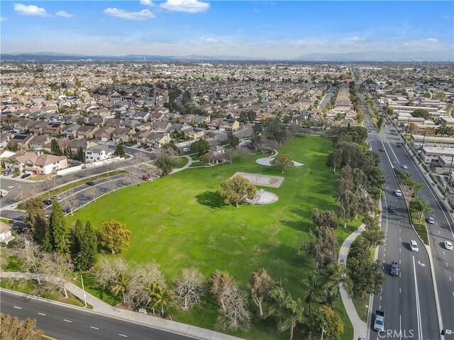 4583 Tuscani Dr, Cypress, CA 90630 - aerial view of property's location with nearby suburban area and mountains