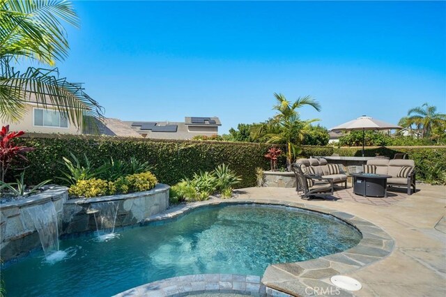 4583 Tuscani Dr, Cypress, CA 90630 - view of swimming pool with a patio, an outdoor living space with a fire pit, and a pool with connected hot tub