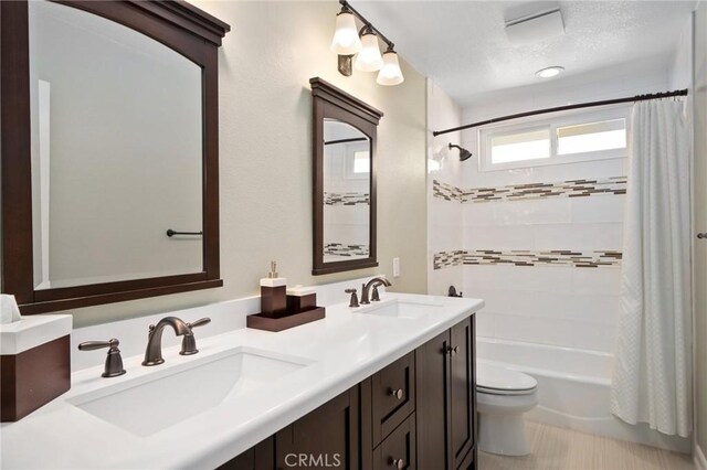 4583 Tuscani Dr, Cypress, CA 90630 - full bath featuring toilet, double vanity, and shower / bathtub combination with curtain