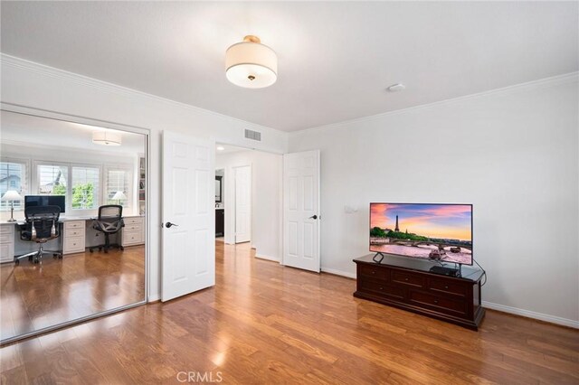 4583 Tuscani Dr, Cypress, CA 90630 - bedroom featuring a desk, wood finished floors, crown molding, and baseboards