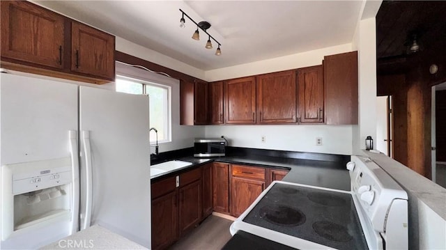 11213 Monte Vista Rd, Phelan, CA 92371 - kitchen with white refrigerator with ice dispenser, stove, and a sink
