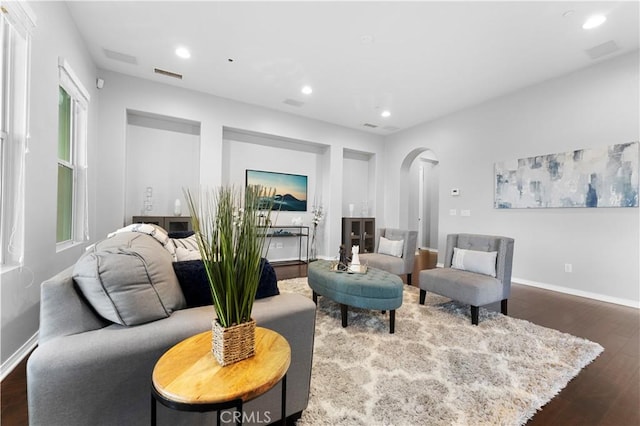 1138 Las Colinas Way, San Dimas, CA 91773 - living room featuring arched walkways, dark wood finished floors, recessed lighting, and baseboards