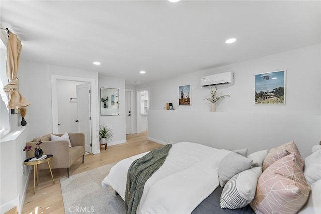 4312 Division St, Los Angeles, CA 90065 - bedroom featuring a wall unit AC, light wood-type flooring, recessed lighting, and baseboards