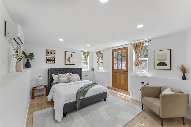4312 Division St, Los Angeles, CA 90065 - bedroom featuring a wall mounted AC, light wood finished floors, recessed lighting, and baseboards
