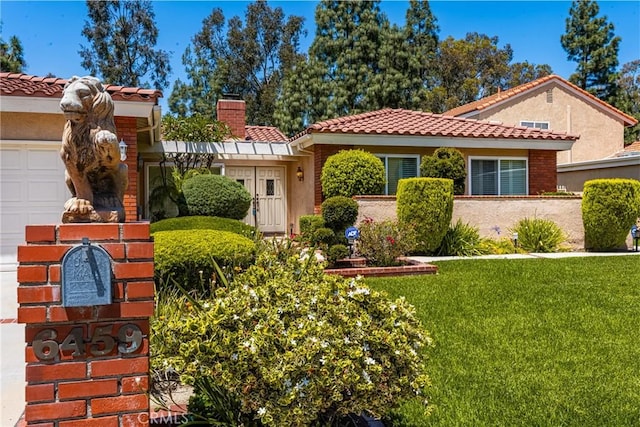 6459 E Via Arboles, Anaheim Hills, CA 92807 - mediterranean / spanish-style home with a tile roof, a chimney, a front lawn, and stucco siding