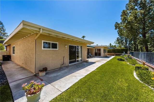 6459 E Via Arboles, Anaheim Hills, CA 92807 - back of house featuring a patio, stucco siding, and central air condition unit