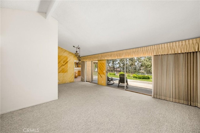 6459 E Via Arboles, Anaheim Hills, CA 92807 - unfurnished living room with wood walls and carpet