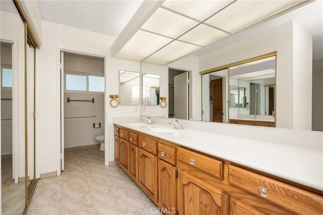 6459 E Via Arboles, Anaheim Hills, CA 92807 - full bath featuring toilet, double vanity, and tile patterned floors
