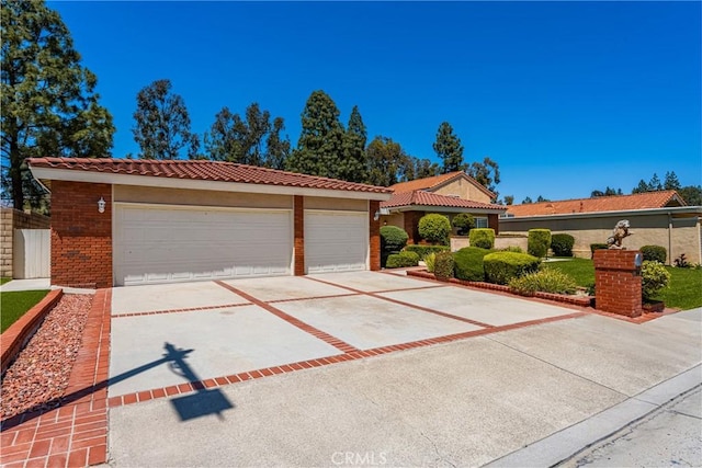 6459 E Via Arboles, Anaheim Hills, CA 92807 - mediterranean / spanish-style home featuring brick siding and a tiled roof