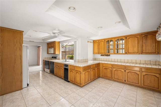 6459 E Via Arboles, Anaheim Hills, CA 92807 - kitchen with a tray ceiling, white appliances, brown cabinets, light tile patterned flooring, and a sink