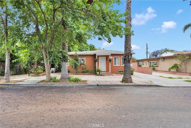 470 E Home St, Long Beach, CA 90805 - view of front facade featuring concrete driveway and stucco siding