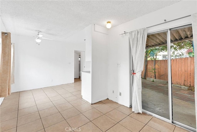 470 E Home St, Long Beach, CA 90805 - empty room featuring a textured ceiling, a ceiling fan, and light tile patterned floors