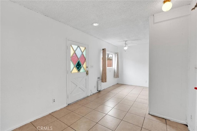 470 E Home St, Long Beach, CA 90805 - foyer entrance with a textured ceiling, a ceiling fan, and light tile patterned floors