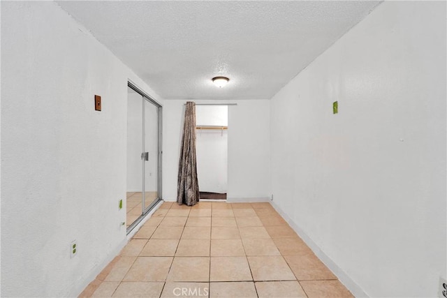 470 E Home St, Long Beach, CA 90805 - spare room with a textured ceiling and light tile patterned floors