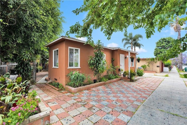 470 E Home St, Long Beach, CA 90805 - view of front of house featuring stucco siding and a patio area