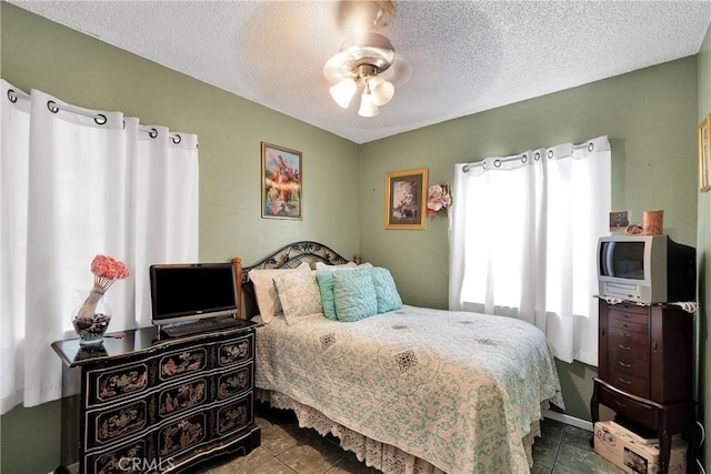 470 E Home St, Long Beach, CA 90805 - tiled bedroom with a textured ceiling and ceiling fan