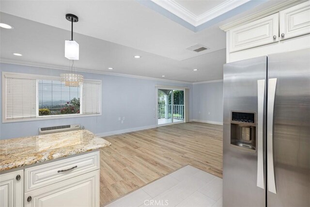 4014 Calle Sonora Oeste Unit 1G, Laguna Woods, CA 92637 - kitchen with stainless steel fridge, crown molding, baseboards, light stone countertops, and recessed lighting