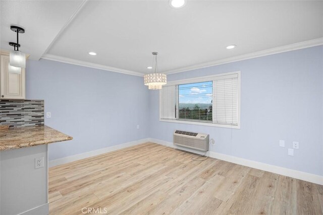 4014 Calle Sonora Oeste Unit 1G, Laguna Woods, CA 92637 - unfurnished dining area featuring a wall unit AC, recessed lighting, light wood finished floors, baseboards, and crown molding