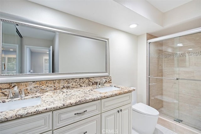 4014 Calle Sonora Oeste Unit 1G, Laguna Woods, CA 92637 - full bathroom featuring a stall shower, toilet, and double vanity