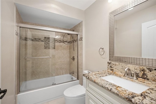 4014 Calle Sonora Oeste Unit 1G, Laguna Woods, CA 92637 - bathroom with toilet, vanity, combined bath / shower with glass door, and backsplash