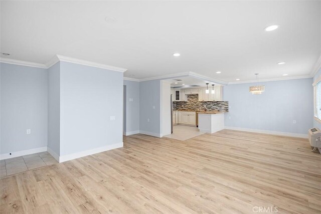 4014 Calle Sonora Oeste Unit 1G, Laguna Woods, CA 92637 - unfurnished living room with recessed lighting, light wood-style floors, baseboards, and crown molding