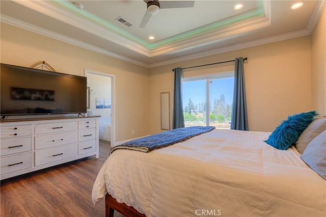 2381 Clearview Dr, Paradise, CA 95969 - bedroom with dark wood-style floors, a tray ceiling, crown molding, connected bathroom, and recessed lighting