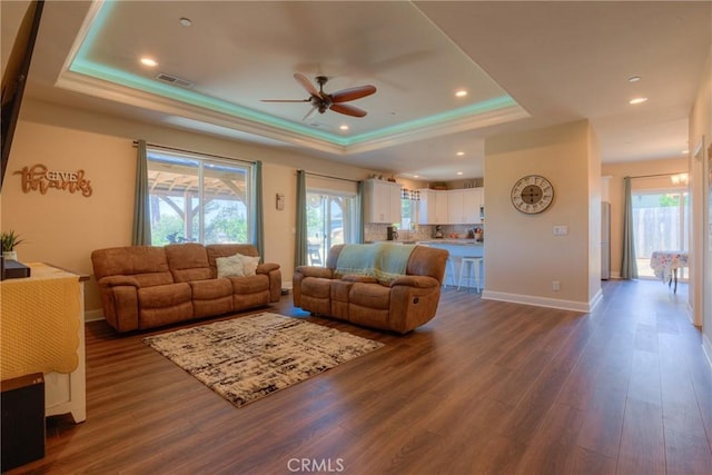 2381 Clearview Dr, Paradise, CA 95969 - living room featuring a tray ceiling, ceiling fan, dark wood-type flooring, baseboards, and recessed lighting