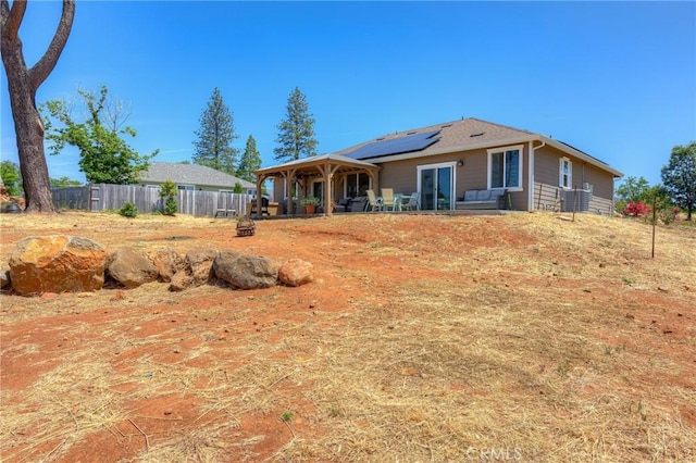 2381 Clearview Dr, Paradise, CA 95969 - back of property featuring roof mounted solar panels and a patio