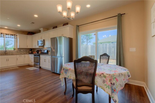 2381 Clearview Dr, Paradise, CA 95969 - dining room with dark wood-style flooring, a chandelier, baseboards, and recessed lighting