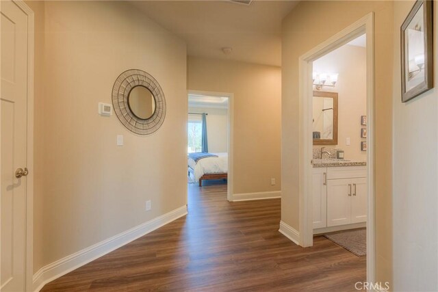 2381 Clearview Dr, Paradise, CA 95969 - hall with dark wood-style flooring, baseboards, and a sink