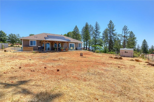 2381 Clearview Dr, Paradise, CA 95969 - rear view of house featuring roof mounted solar panels and a patio area
