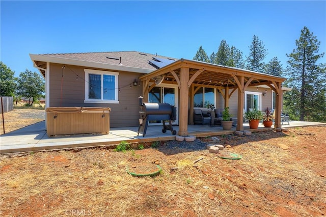 2381 Clearview Dr, Paradise, CA 95969 - back of property with a hot tub and a patio