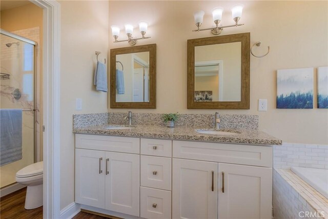 2381 Clearview Dr, Paradise, CA 95969 - full bath featuring a shower stall, toilet, double vanity, and a garden tub