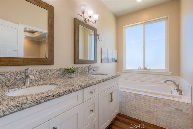 2381 Clearview Dr, Paradise, CA 95969 - full bathroom featuring double vanity, a bath, wood finished floors, and crown molding