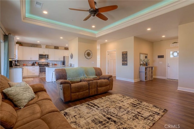 2381 Clearview Dr, Paradise, CA 95969 - living room with ceiling fan, a tray ceiling, crown molding, dark wood-style flooring, and recessed lighting