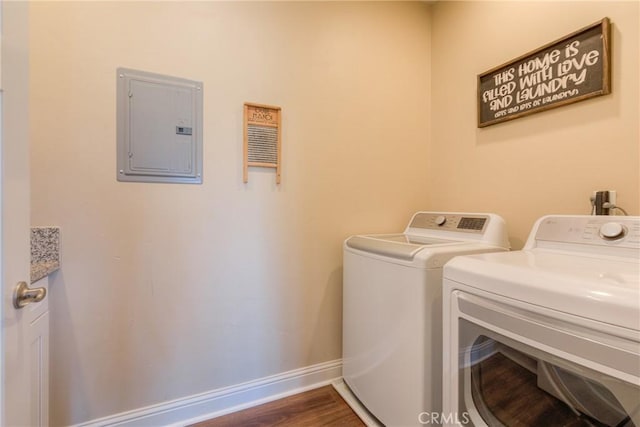 2381 Clearview Dr, Paradise, CA 95969 - washroom featuring electric panel, washing machine and clothes dryer, baseboards, and dark wood-type flooring
