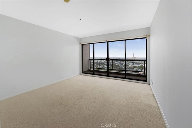 10724 Wilshire Blvd Unit 1010, Los Angeles, CA 90024 - carpeted empty room featuring baseboards