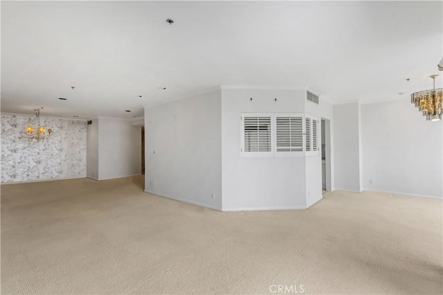 10724 Wilshire Blvd Unit 1010, Los Angeles, CA 90024 - unfurnished room featuring a chandelier, light colored carpet, and a pendent fire sprinkler