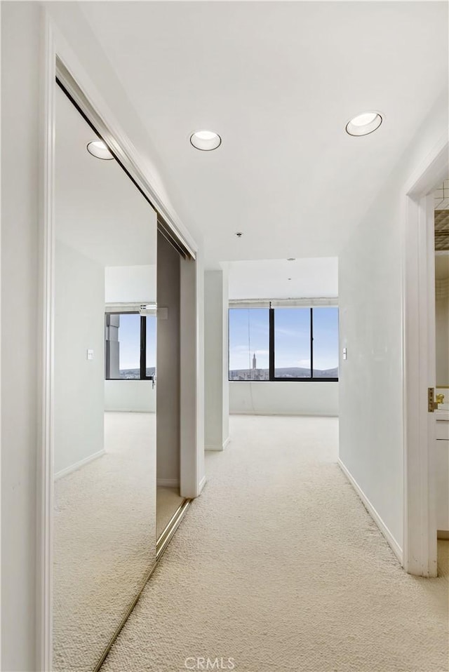 10724 Wilshire Blvd Unit 1010, Los Angeles, CA 90024 - hallway with carpet flooring, plenty of natural light, and recessed lighting
