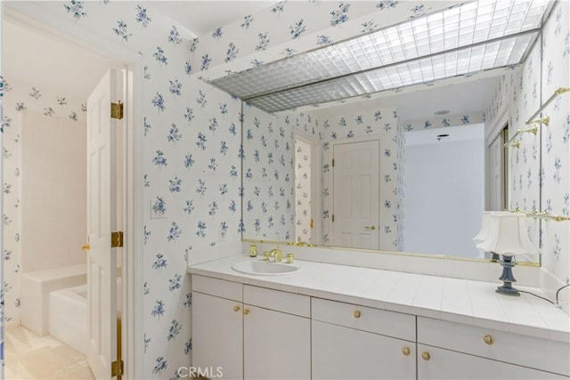 10724 Wilshire Blvd Unit 1010, Los Angeles, CA 90024 - full bath with wallpapered walls and vanity
