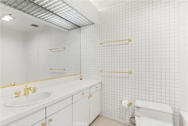 10724 Wilshire Blvd Unit 1010, Los Angeles, CA 90024 - bathroom with tile walls and vanity