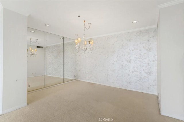 10724 Wilshire Blvd Unit 1010, Los Angeles, CA 90024 - empty room featuring a chandelier, carpet flooring, recessed lighting, crown molding, and wallpapered walls