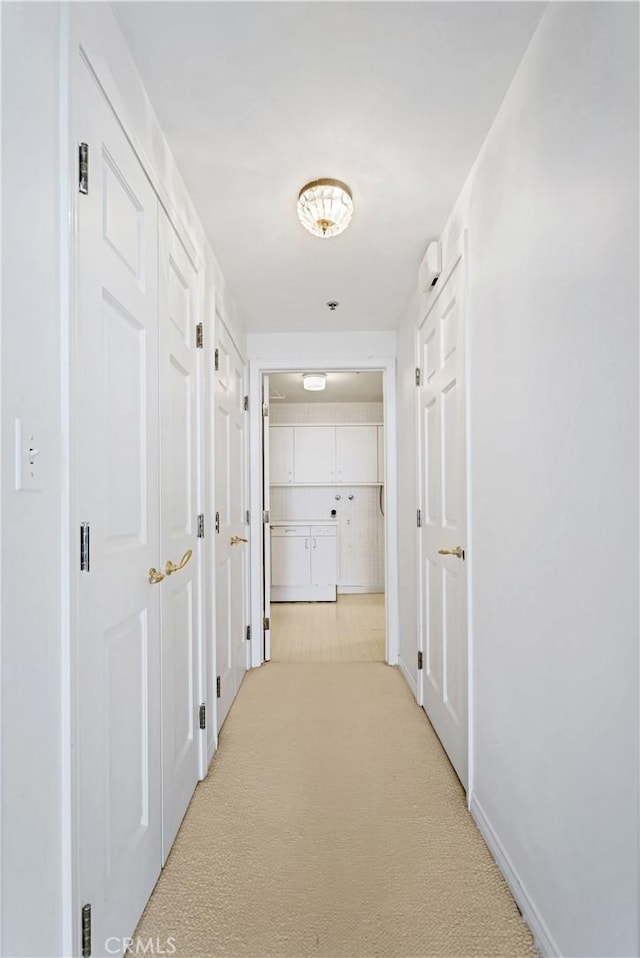 10724 Wilshire Blvd Unit 1010, Los Angeles, CA 90024 - corridor with light carpet and baseboards