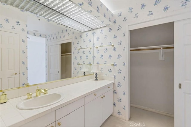 10724 Wilshire Blvd Unit 1010, Los Angeles, CA 90024 - bathroom featuring wallpapered walls and vanity