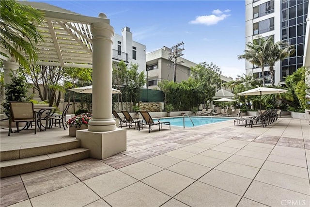 10724 Wilshire Blvd Unit 1010, Los Angeles, CA 90024 - community pool featuring a patio and outdoor dining space