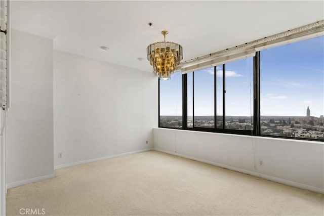 10724 Wilshire Blvd Unit 1010, Los Angeles, CA 90024 - spare room featuring a chandelier, carpet, and a pendent fire sprinkler